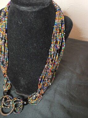 Multi Seabead Necklace With A Pendant It Goes Over Your Head And Does Carry Some